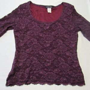 Stretch lace top with scoop neck.